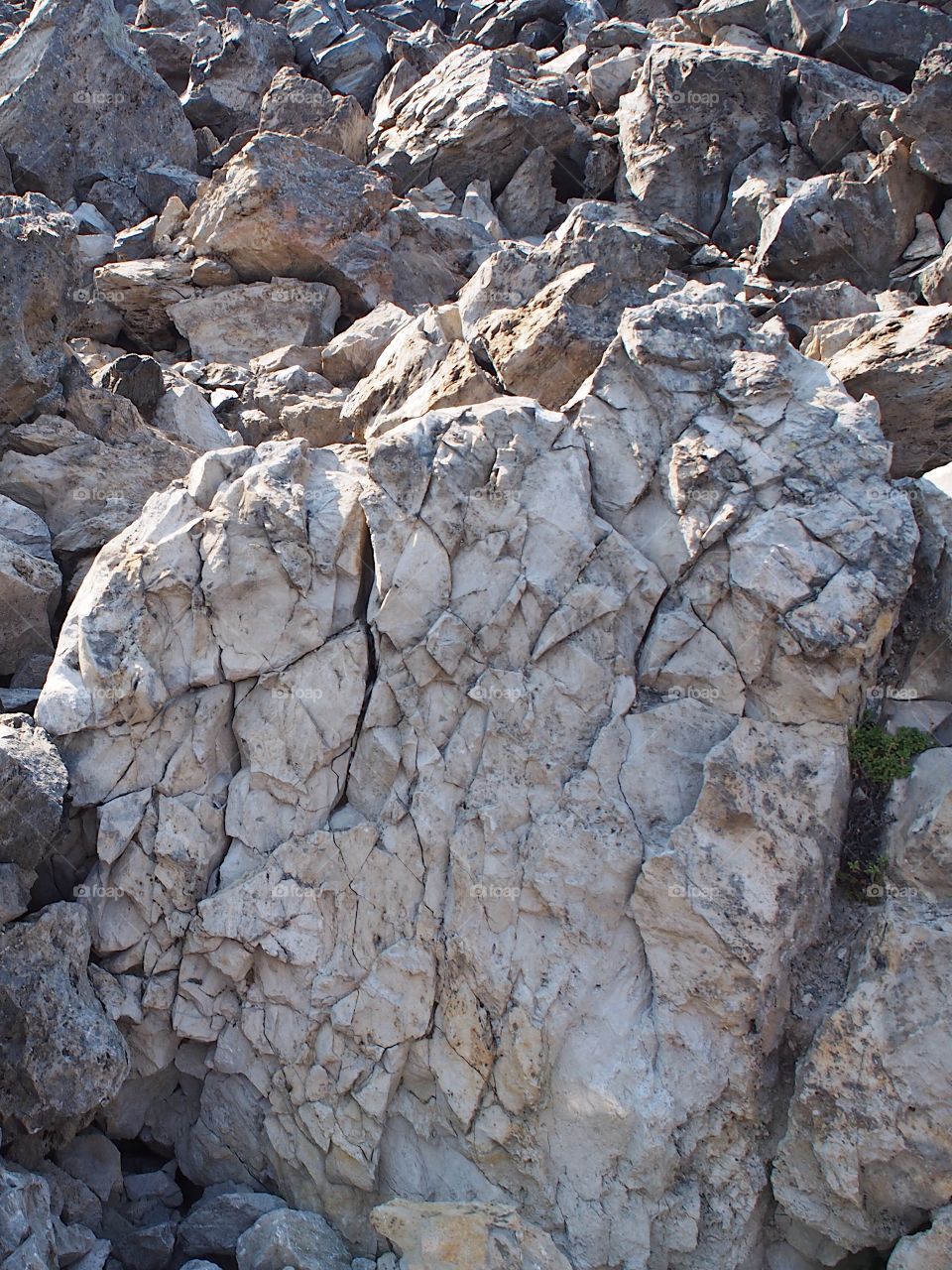 The rugged terrain of the jagged rocks at the Big Obsidian Flow in the Newberry National Volcanic Monument in Central Oregon in the fall. 