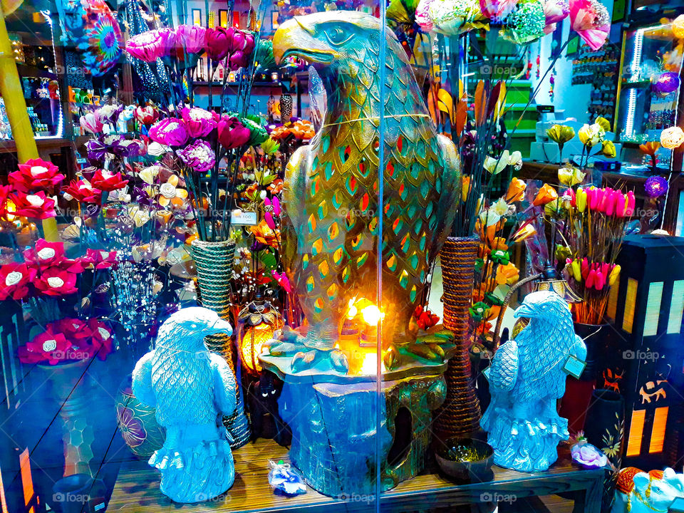 Decoration ideas for interior decoration, lighted eagle, many decorative colourful flowers and blue bird decoration.