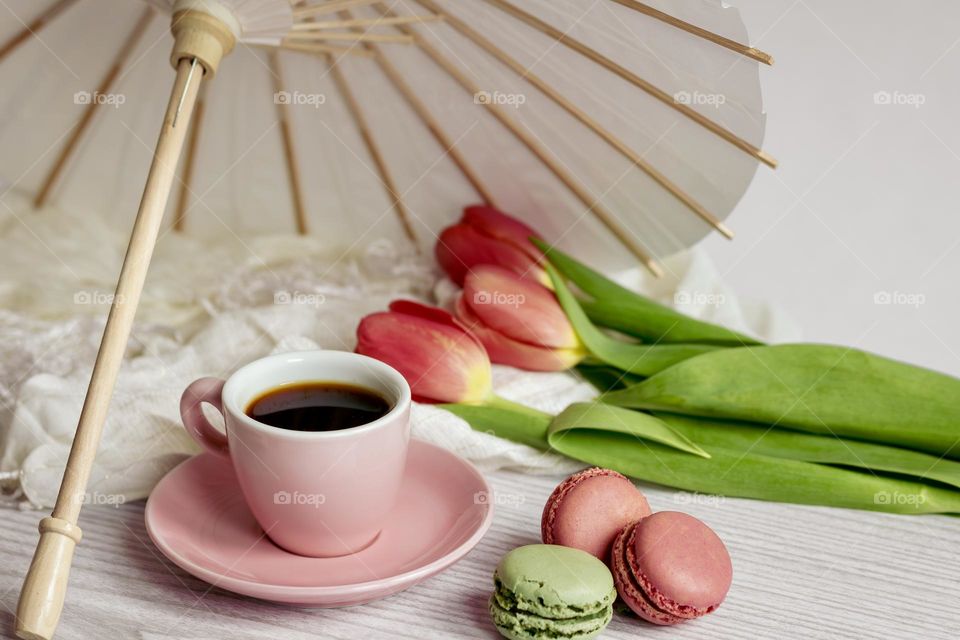 Pink & green tulips and macaroons with coffee