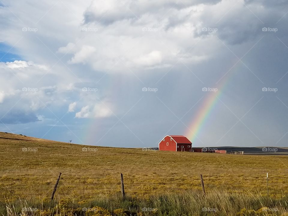Red barn and rainbow