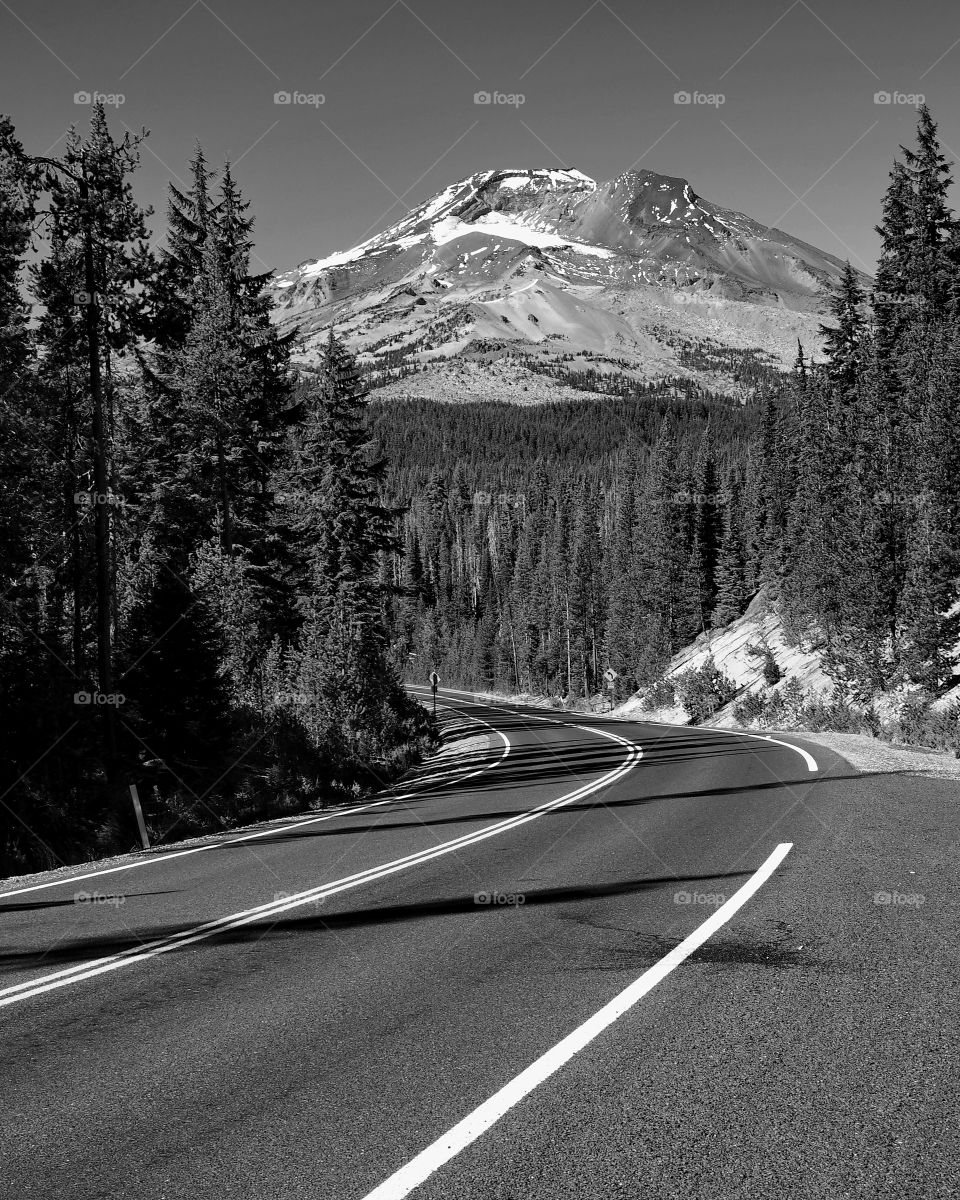 The South Sister of the Cascade Mountain Range appears suddenly while taking a relaxing drive on a fall day on the Cascade Lakes Highway in the Pacific Northwest. 