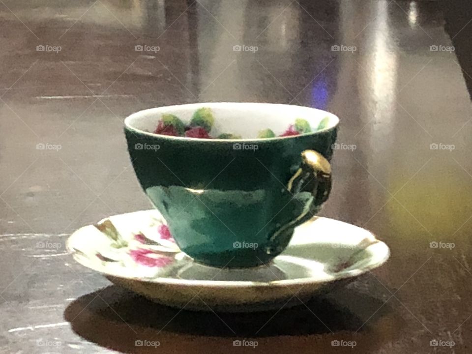 Tea cup and saucer on table