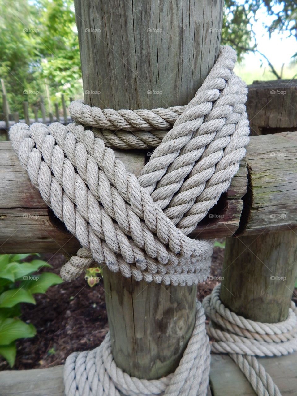 Tied in a knot. Rope tied post