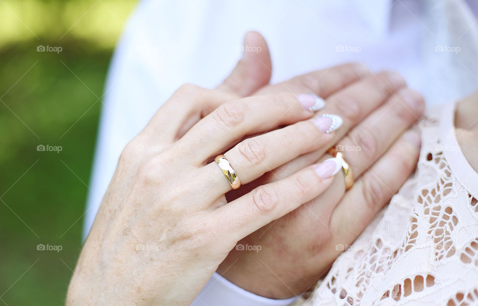 Bride hand with golden rings