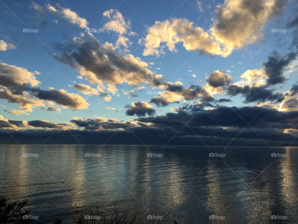 Scenic view of sea against cloudy sky