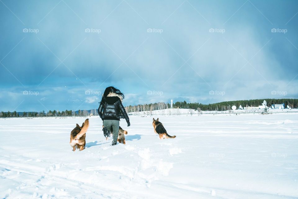 an owner is running with his pets