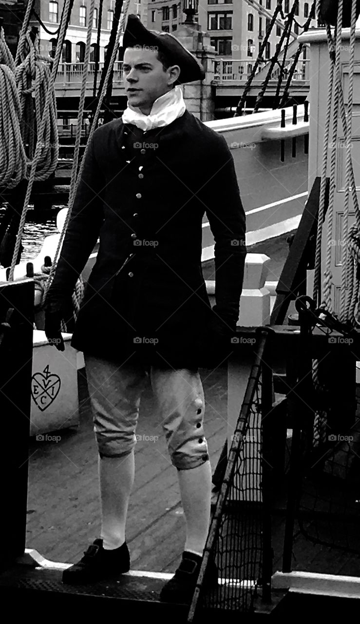 Man in uniform standing on ship