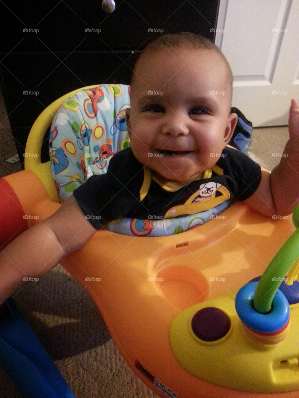 Happy Baby. Happy to be rolling in his walker