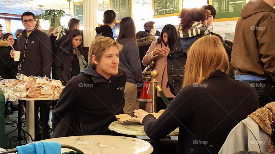 couple in bagel shop. dining out