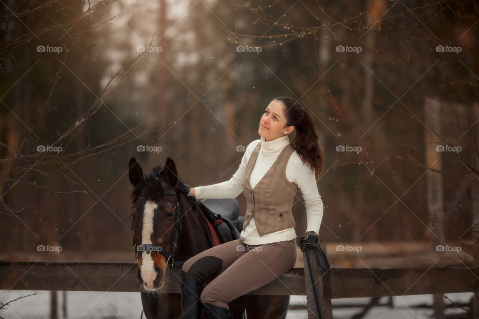 Young beautiful woman with horse outdoor portrait at spring day