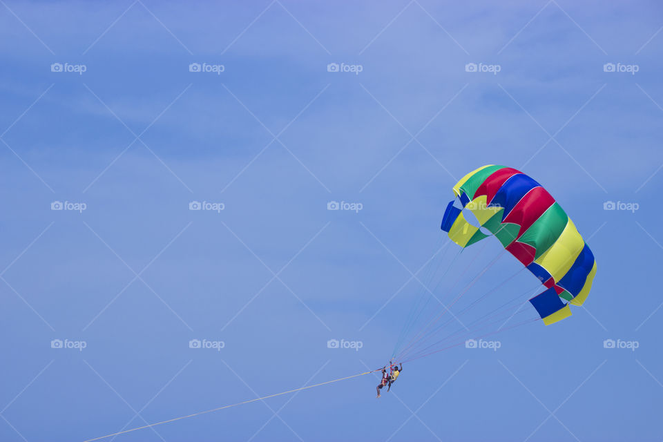 Parasailing on ocean water, water sports