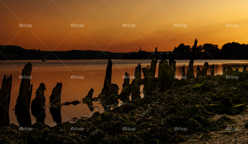 After sunset, the sky takes on fantastic colors. Here we have a warm and Deep dark Orange bronze.