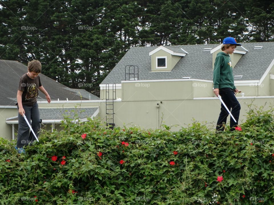 Young Boys Playing In A Field
