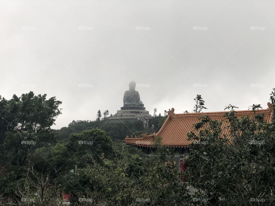 A cloudy and stormy day. Po Lin Monastery,Buddha, symbolizing Unity with Nature and People-in Lantau Island, Ngong Ping Village, Hong Kong