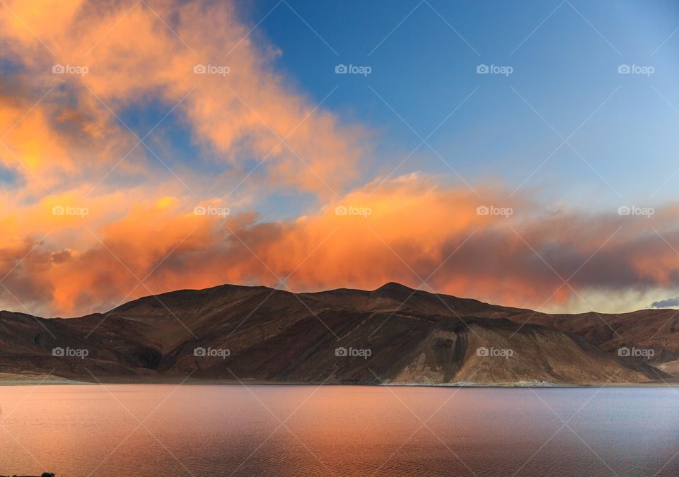 serene natural light falling over lake pagong, ladakh, India