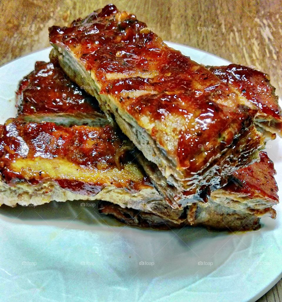 BBQ baby back ribs with spicy barbecue sauce.