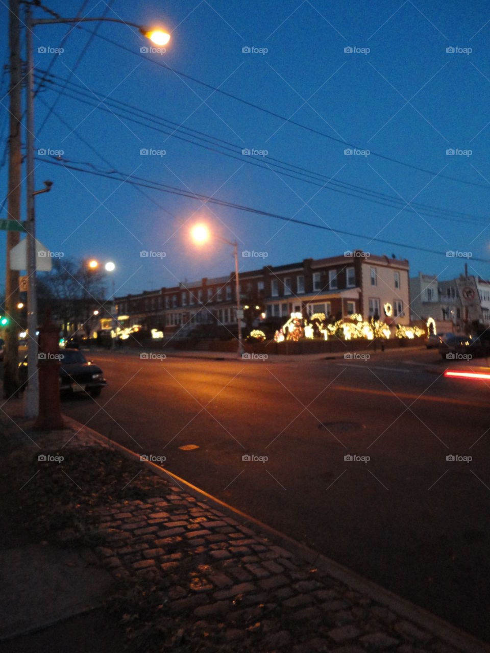 Clear crisp winter night. Beautiful blue sky. America's first suburb, Brooklyn, Christmas lights.