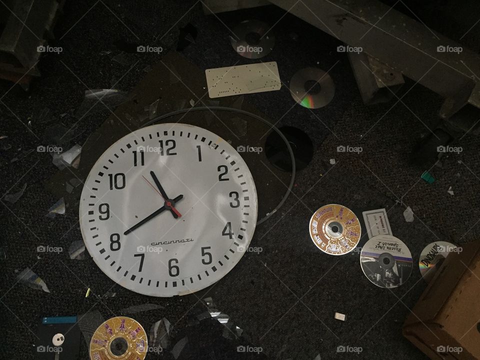 Broken clock that was discovered in a torn apart and trashed, abandoned school. 