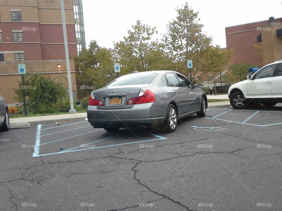 Bad parking!. Very bad parking in a handicap spot.