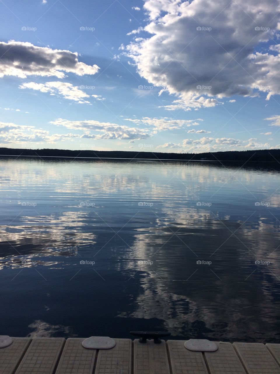 Beautiful reflection on the Carson Pegasus Lake in Alberta, Canada