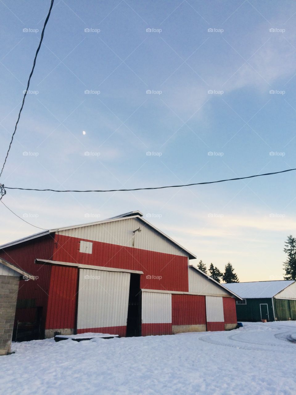 Beautiful picture of barns and the wonderful sky
