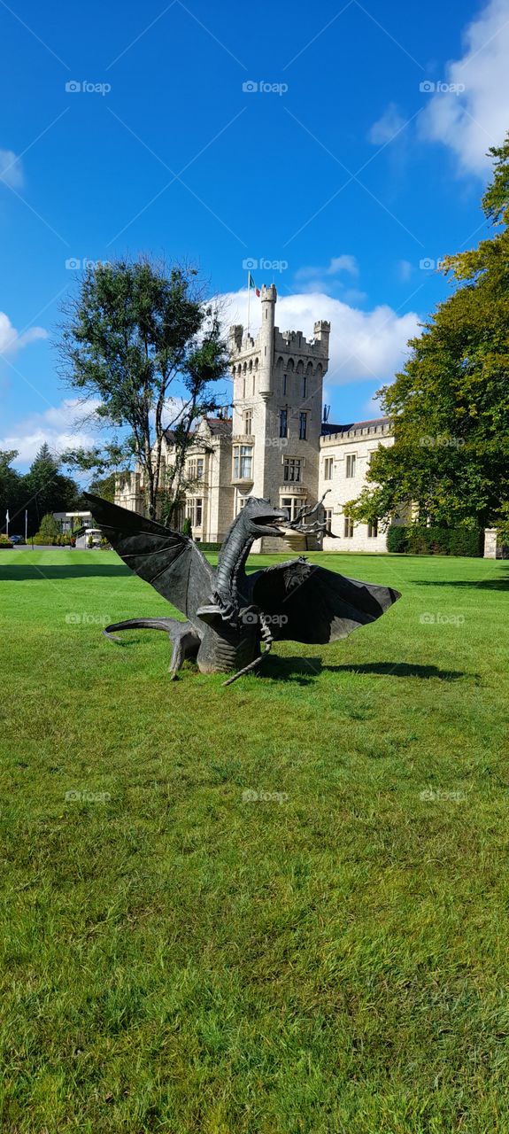 Lough Eske Castle grounds Ireland with Dragon statue, summertime walks