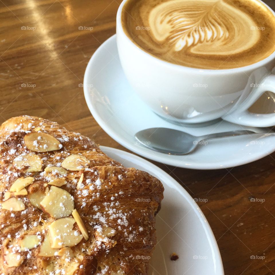 Almond croissant and a latte