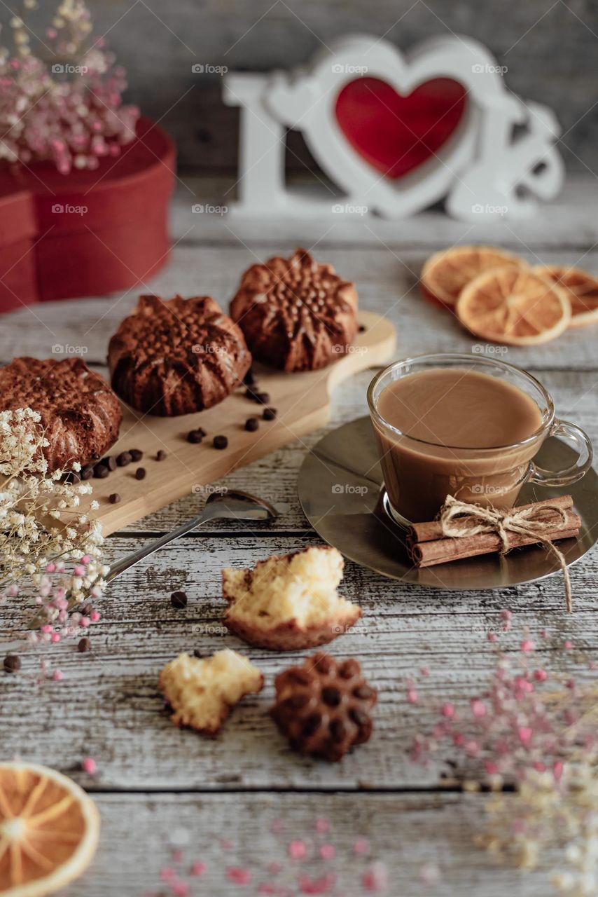 Food photo coffee with milk and muffins on wooden background, delicious breakfast