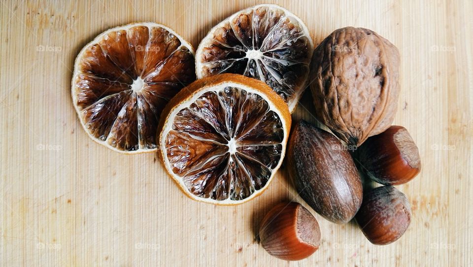 wooden brown dryied fruit and nuts background