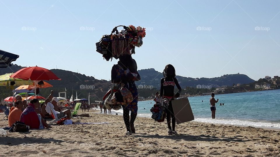 Child labor at the beach,  Italy
