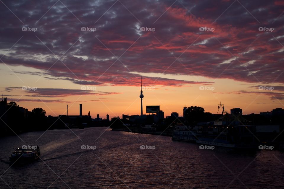 View over Berlin skyline from Oberbaumbrücke in Kreuzberg at colorful sunset