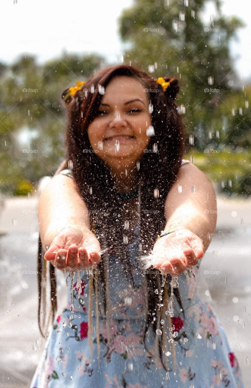 Happy moments happy women in the rain summer