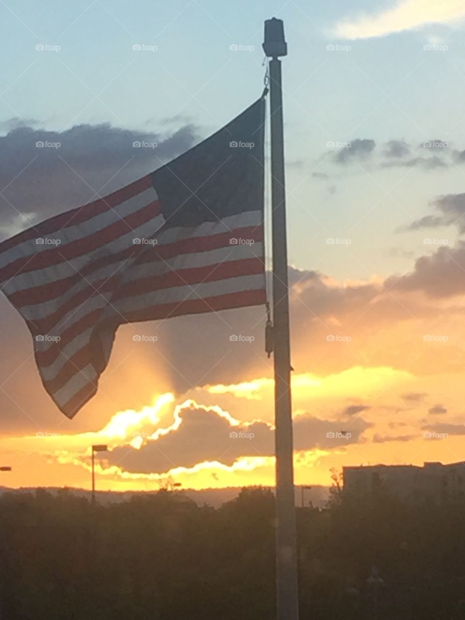 American flag with a sunset background 