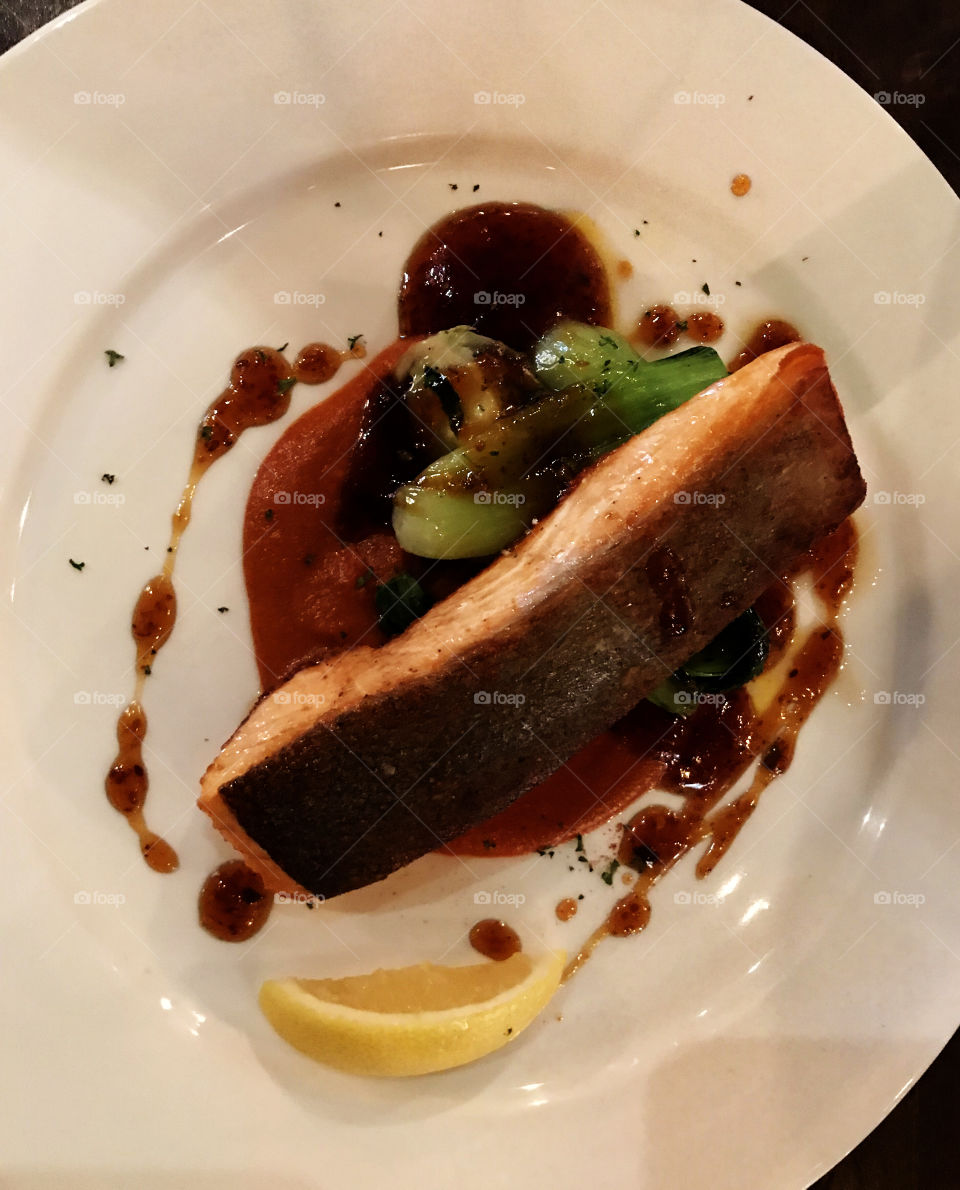King New Zealand salmon cooked on the dish on restaurant in Bangkok. Looks delicious and the taste is superb!