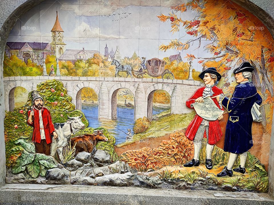 ceramic panels "life in the German settlement of the 17th century".a peasant and two architects in a 17th century countryside