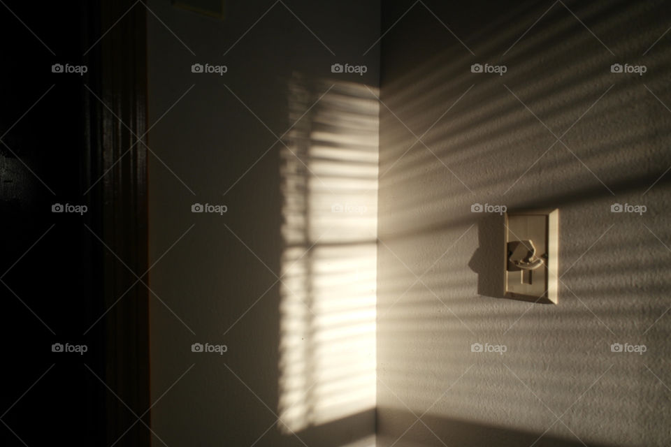 Light shining through a window onto a wall