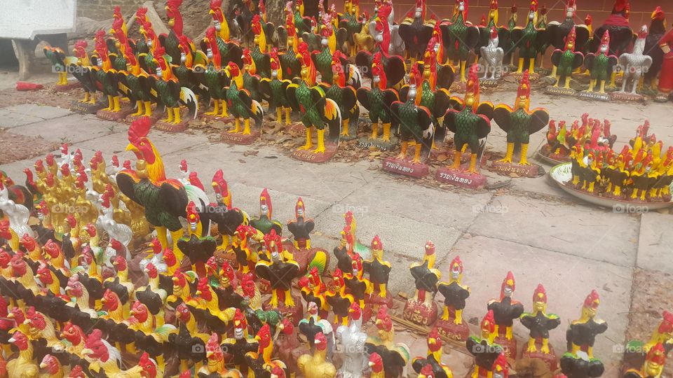 Colorful of many rooster statues at Bang kung Temlple in samutsongkram , Thailand