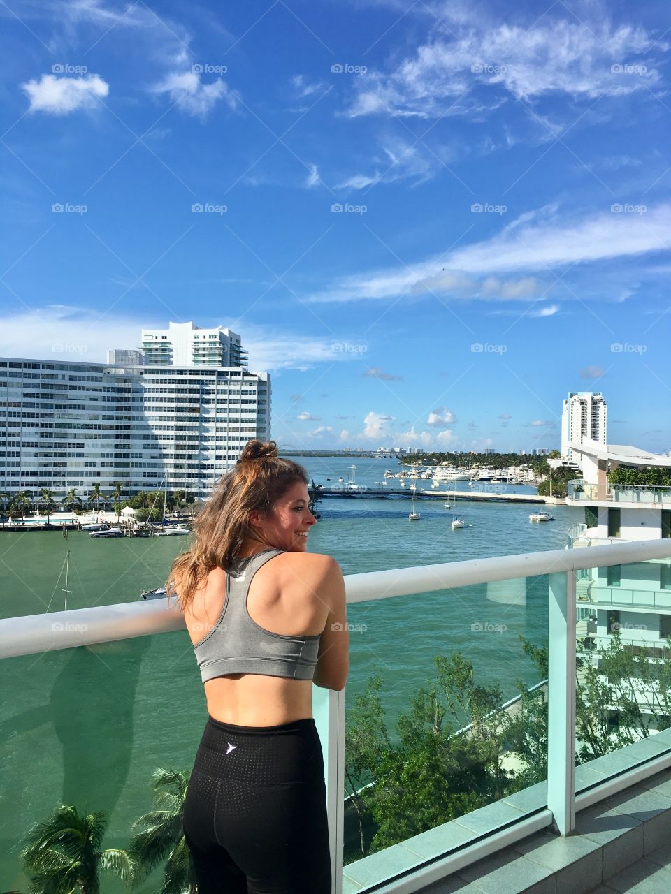 Fitness girl overlooking water