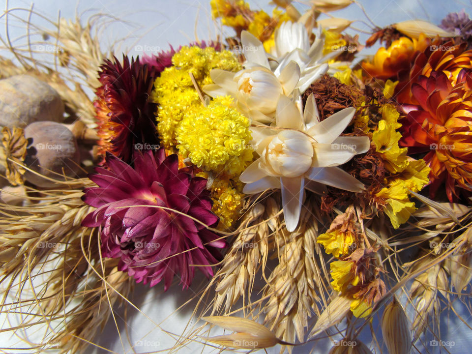 a bouquet of dried flowers and poppies on holiday