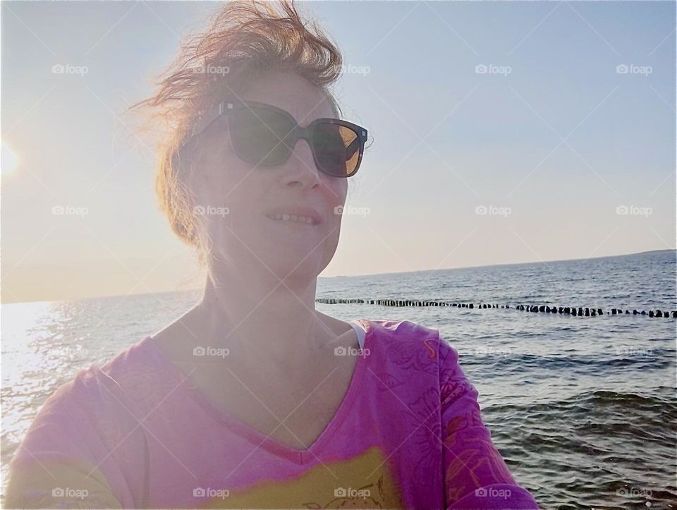 Sun swept with her hair blowing in the wind this is our globetrotting lady at the “Strelasund”, a part of the “Baltic Sea” surrounding the island “Rügen” in “Mecklenburg - Western Pomerania”, Germany. 2024. Hypnotic Productions