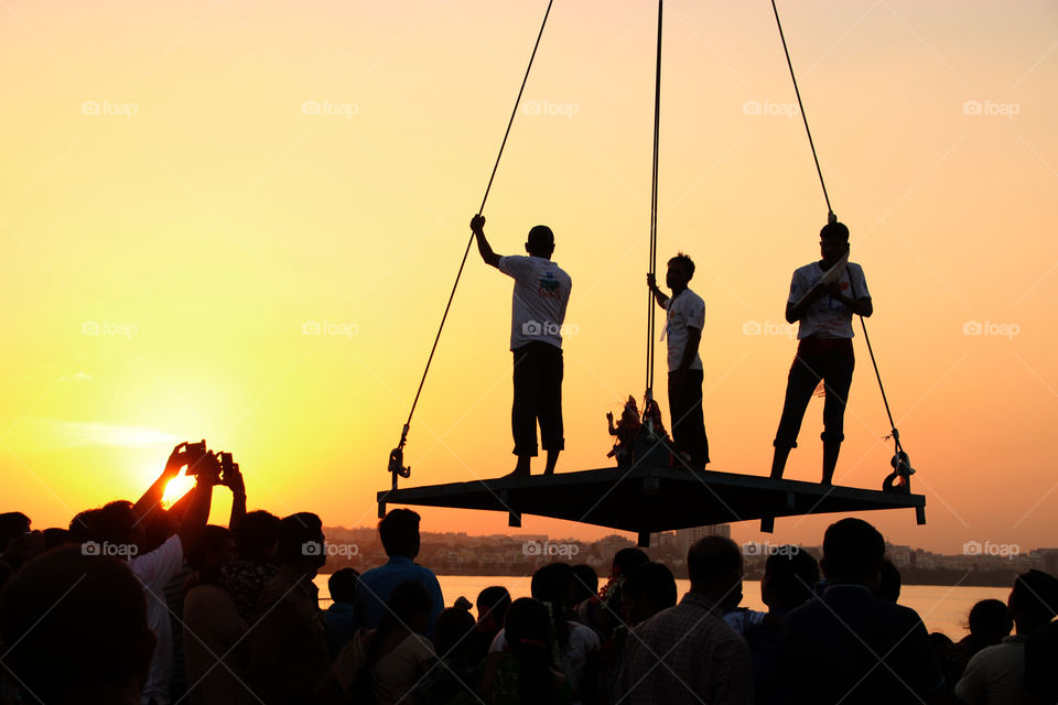 Workers lifted on crane