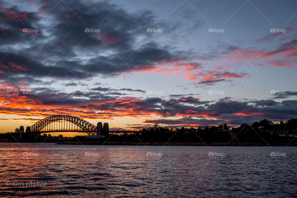 Rain overnight then clearing for a colourful dawn on Sydney Harbour