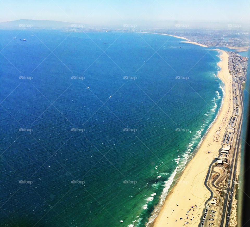 This photo was taken from a plane and features the coastline of Southern California's Beach Cities.