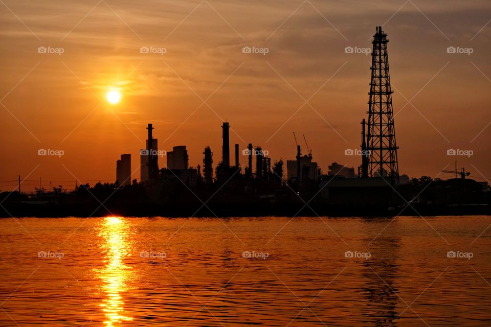 Sunrise above oil refinery in Bangkok Thailand