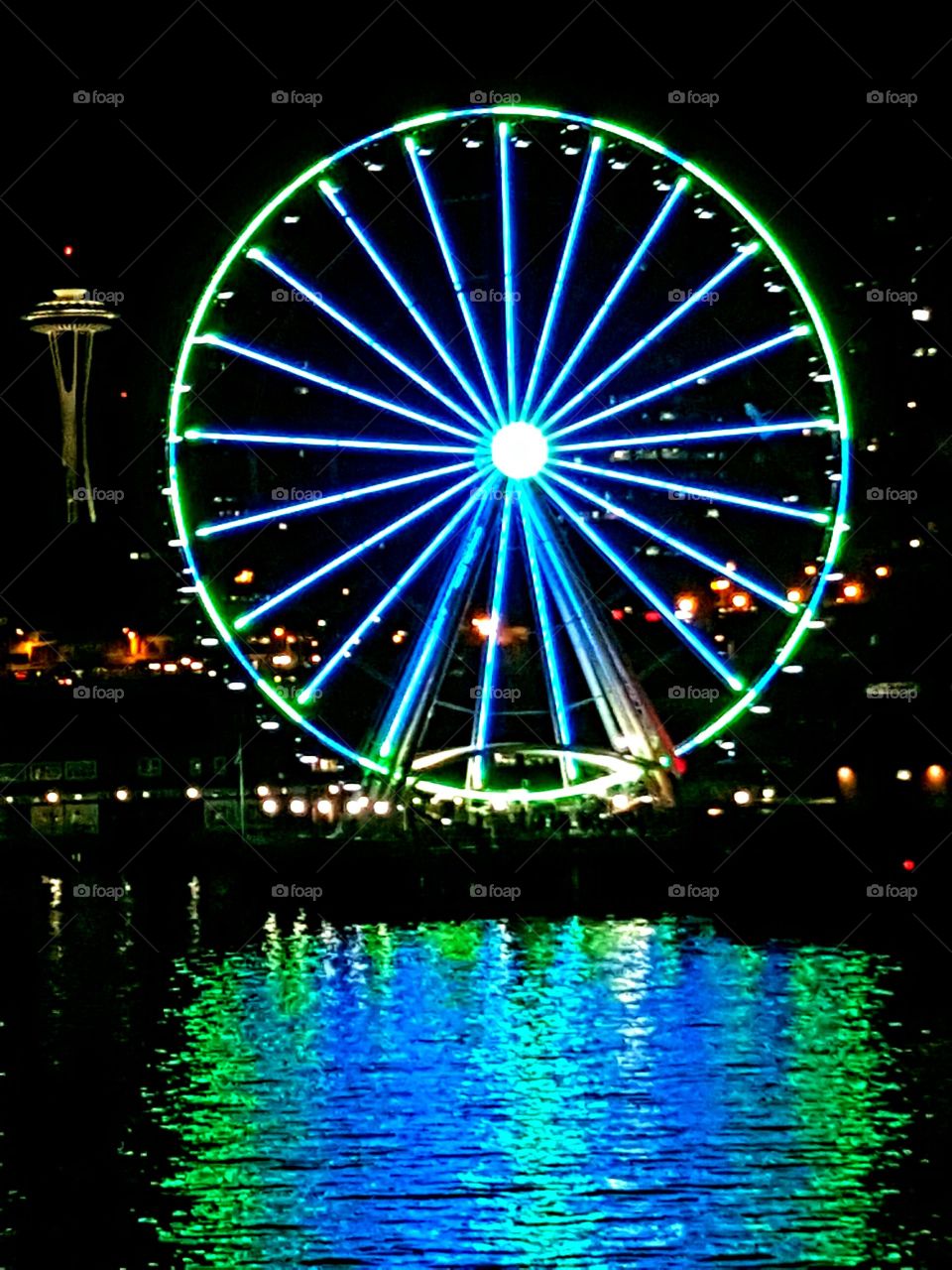 View of the Big Wheel from the Bremerton Ferry - displaying the Seahawks colors of blue and green.