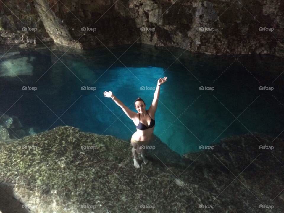 High angle view of a woman in bikini standing in water