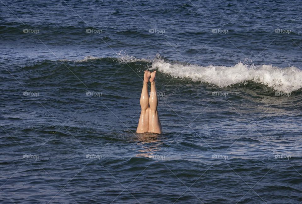 Diving legs in the sea water