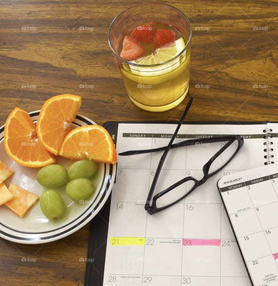 Getting a snack while putting schedule on the calendar 
