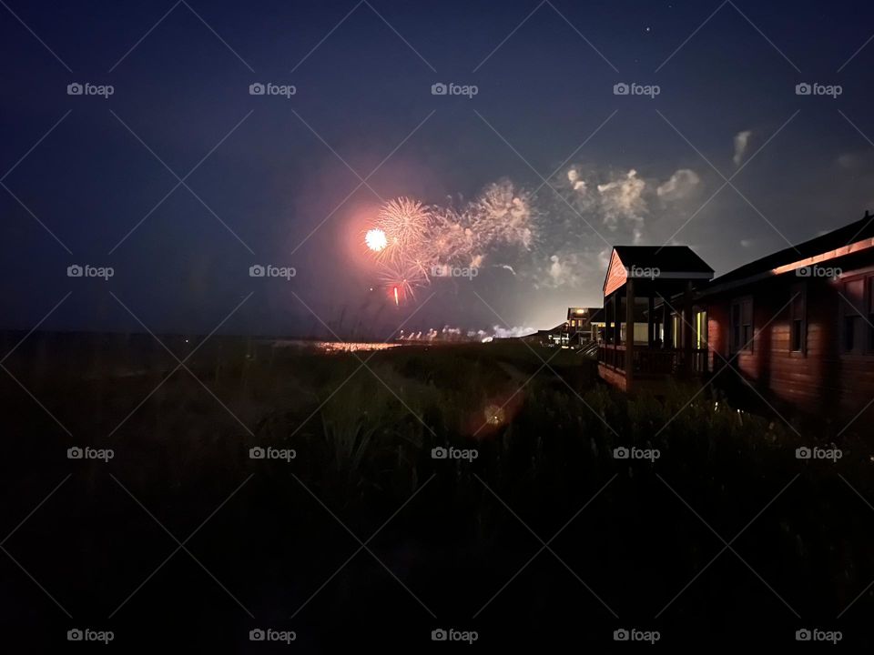 Celebrating 4th of July with fireworks at the beach. 