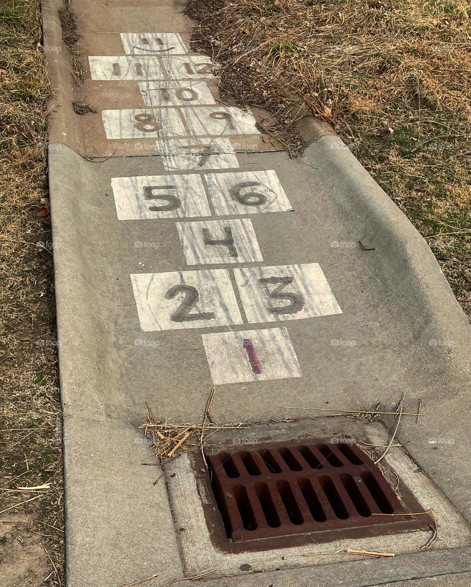Hop-Scotch and Sewer Drains